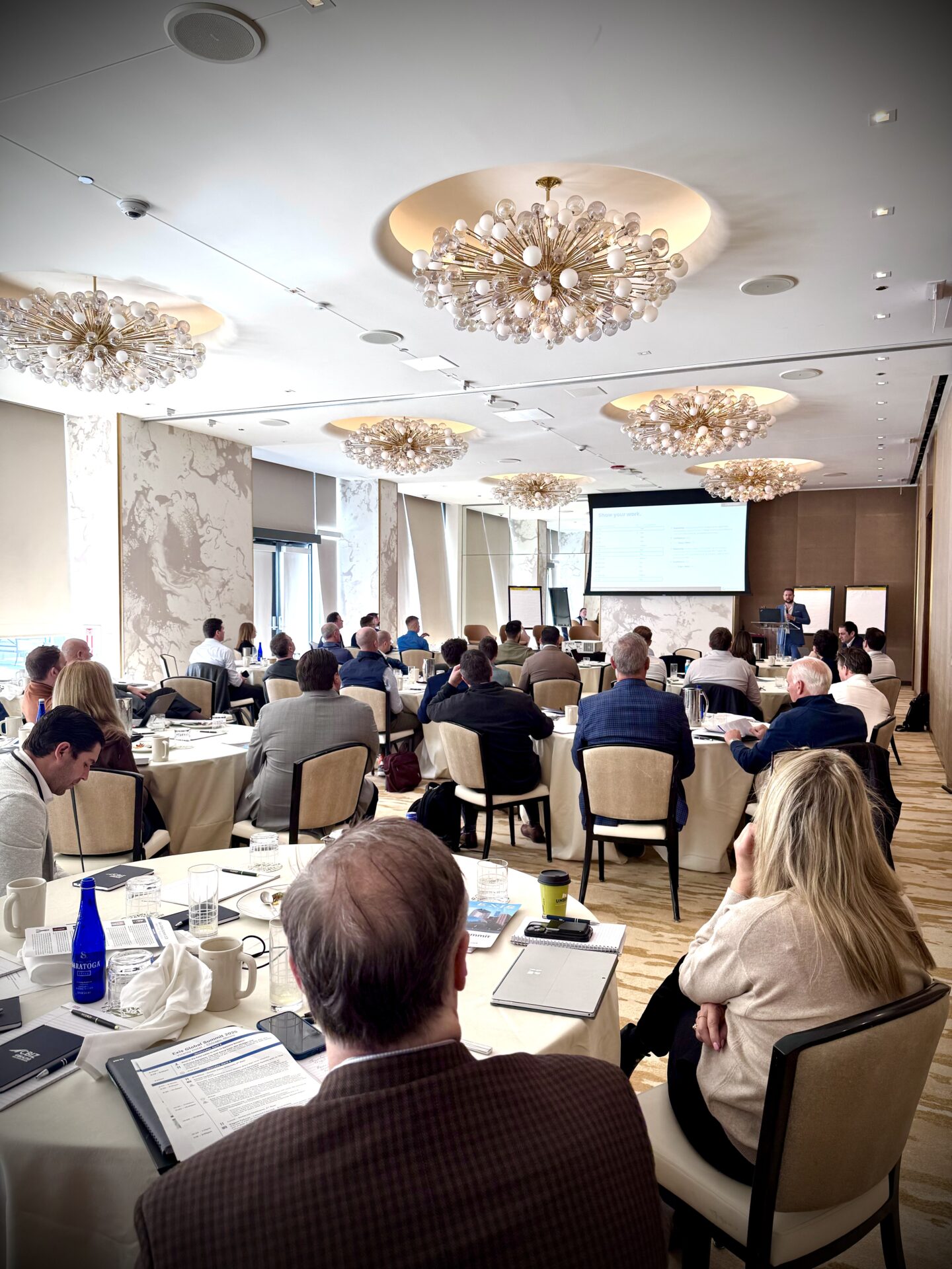 Corey Peck presenting an AI sales systems workshop to a room of founders
